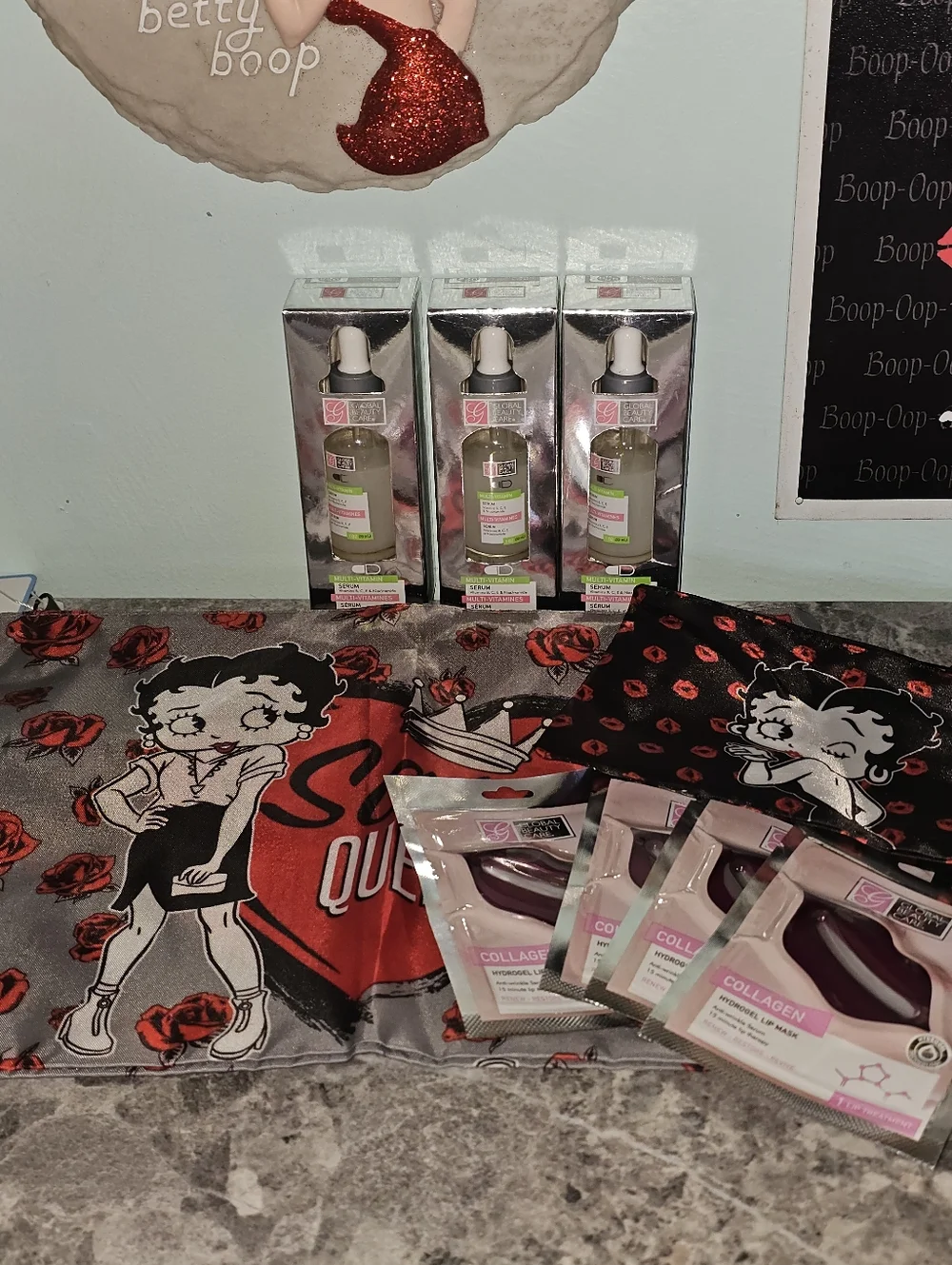 9pc Betty Boop Sassy Queen Tote, Cosmetic Pouch, 3 Serums & 4 Lip Masks!